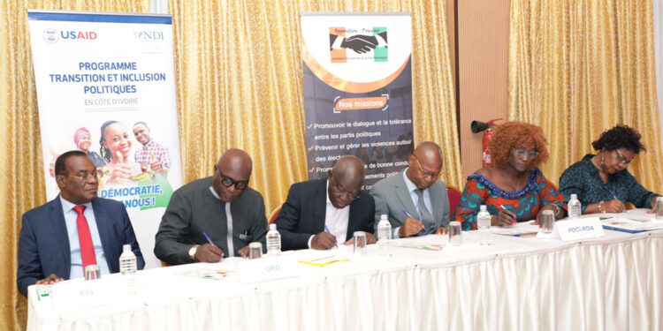 Les photos de la signature du code de bonne conduite des partis,…